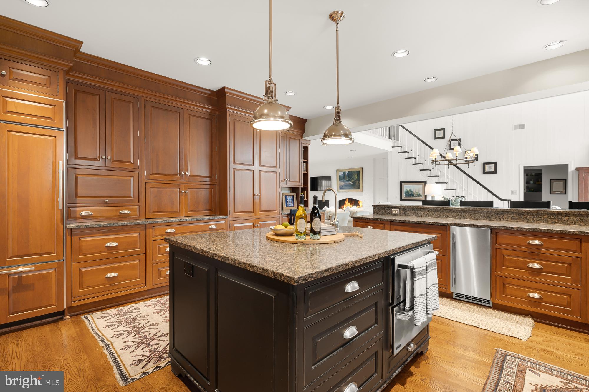 11101 Piney Meetinghouse Road Potomac, MD 20854 - Photo 16 of 96 Elegant kitchen with rich wood tones.
