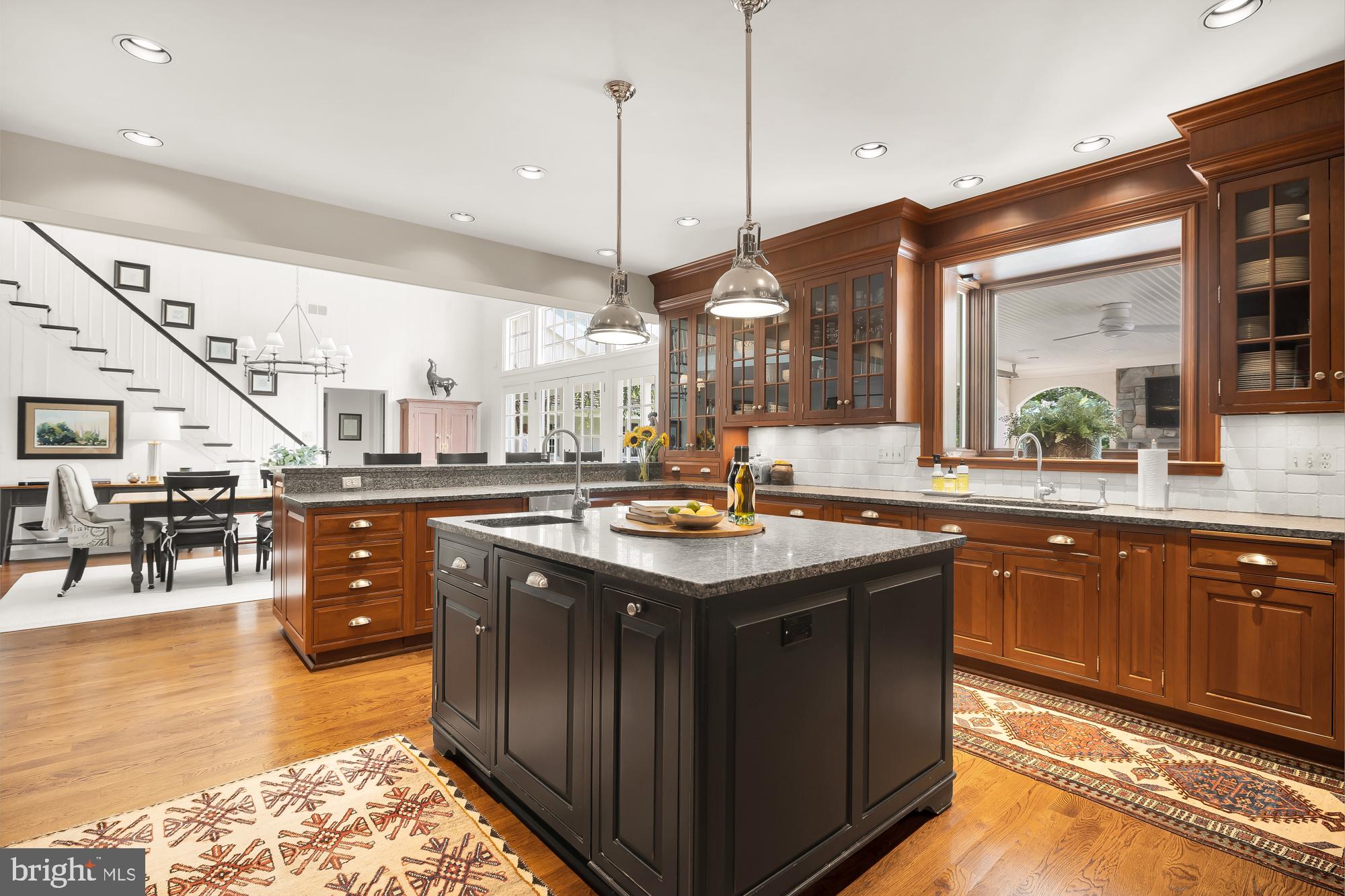11101 Piney Meetinghouse Road Potomac, MD 20854 - Photo 17 of 96 Elegant kitchen with rich wood accents.