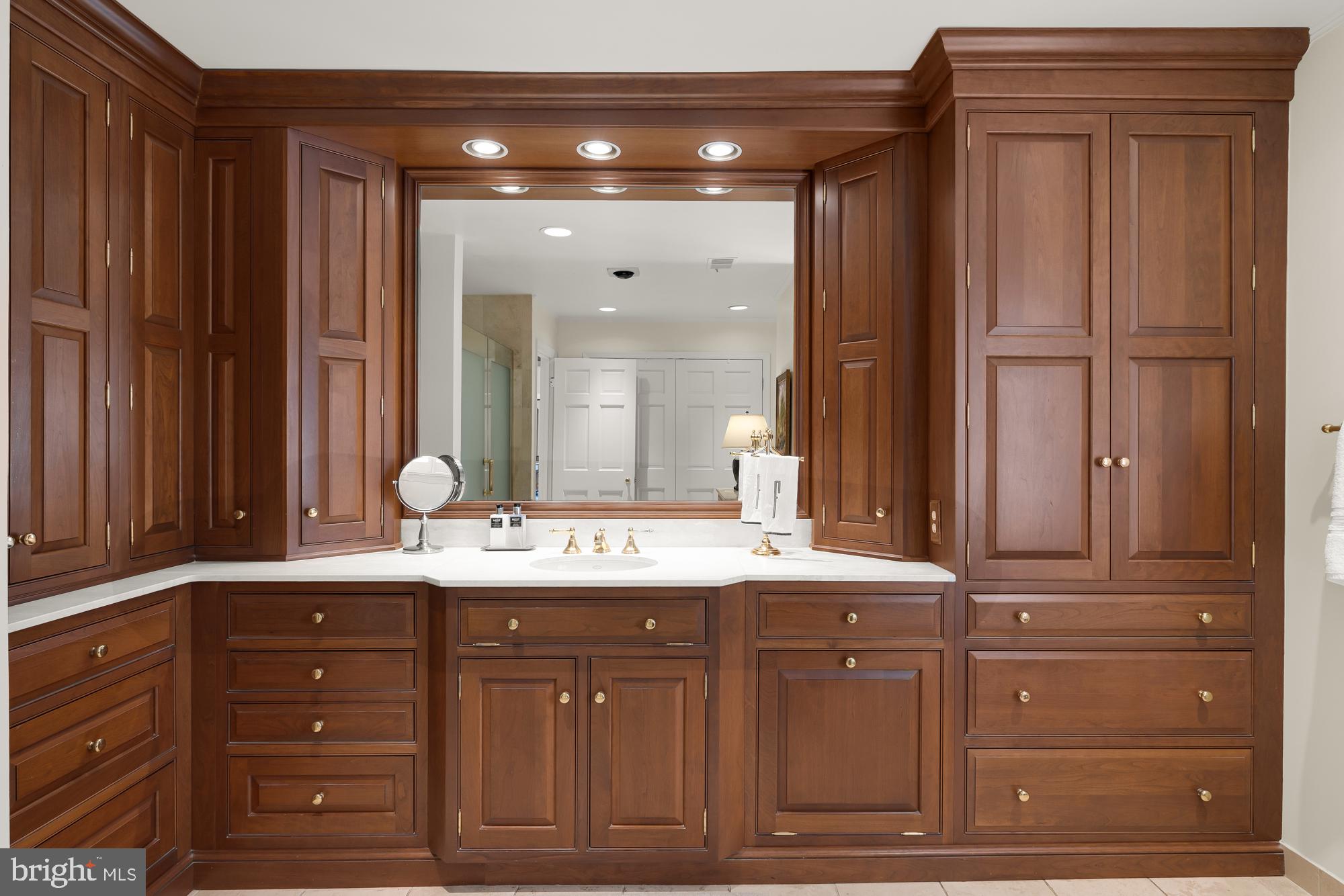 11101 Piney Meetinghouse Road Potomac, MD 20854 - Photo 38 of 96 Elegant wooden cabinetry in a serene bath.