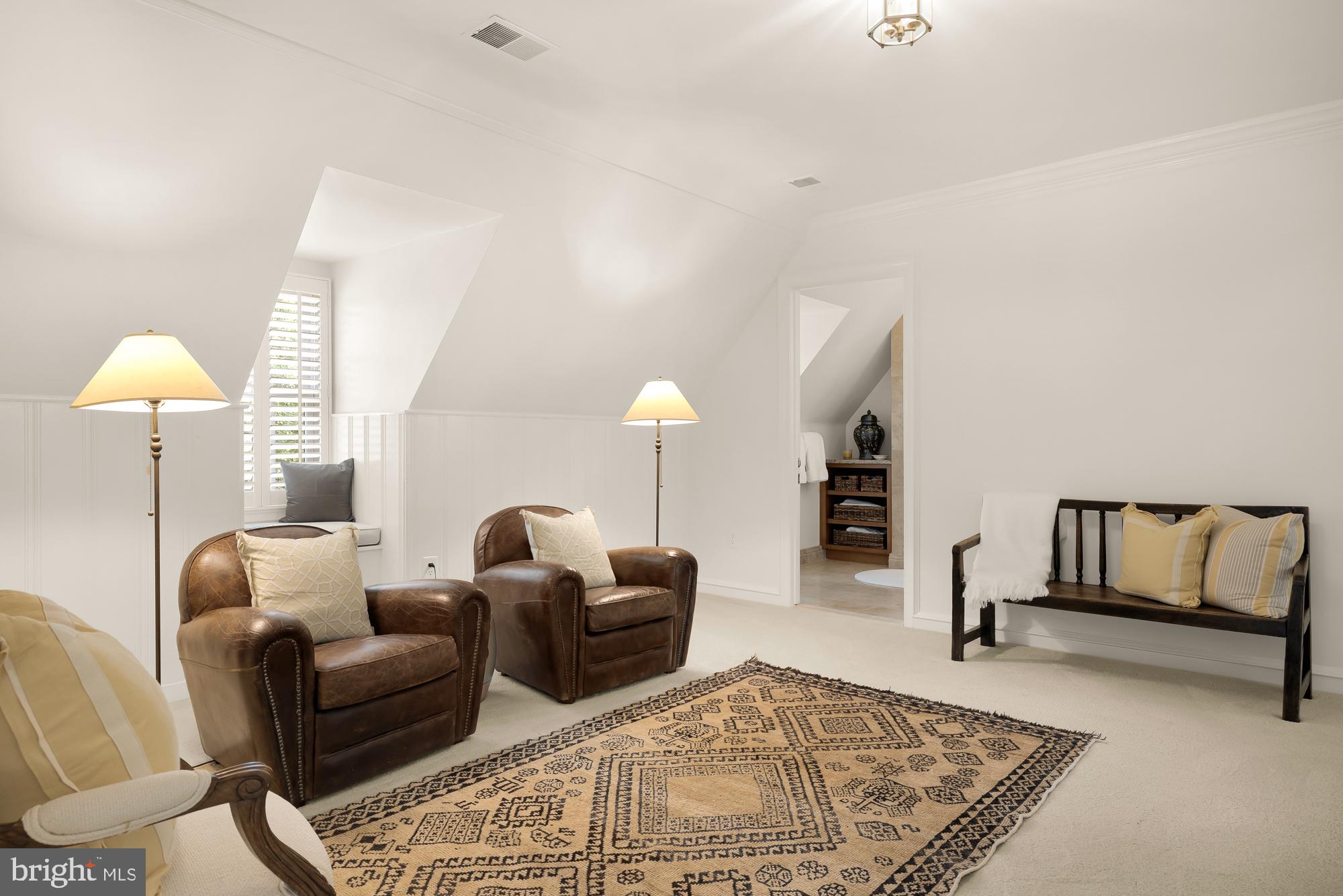 11101 Piney Meetinghouse Road Potomac, MD 20854 - Photo 45 of 96 Cozy attic retreat with warm lighting.