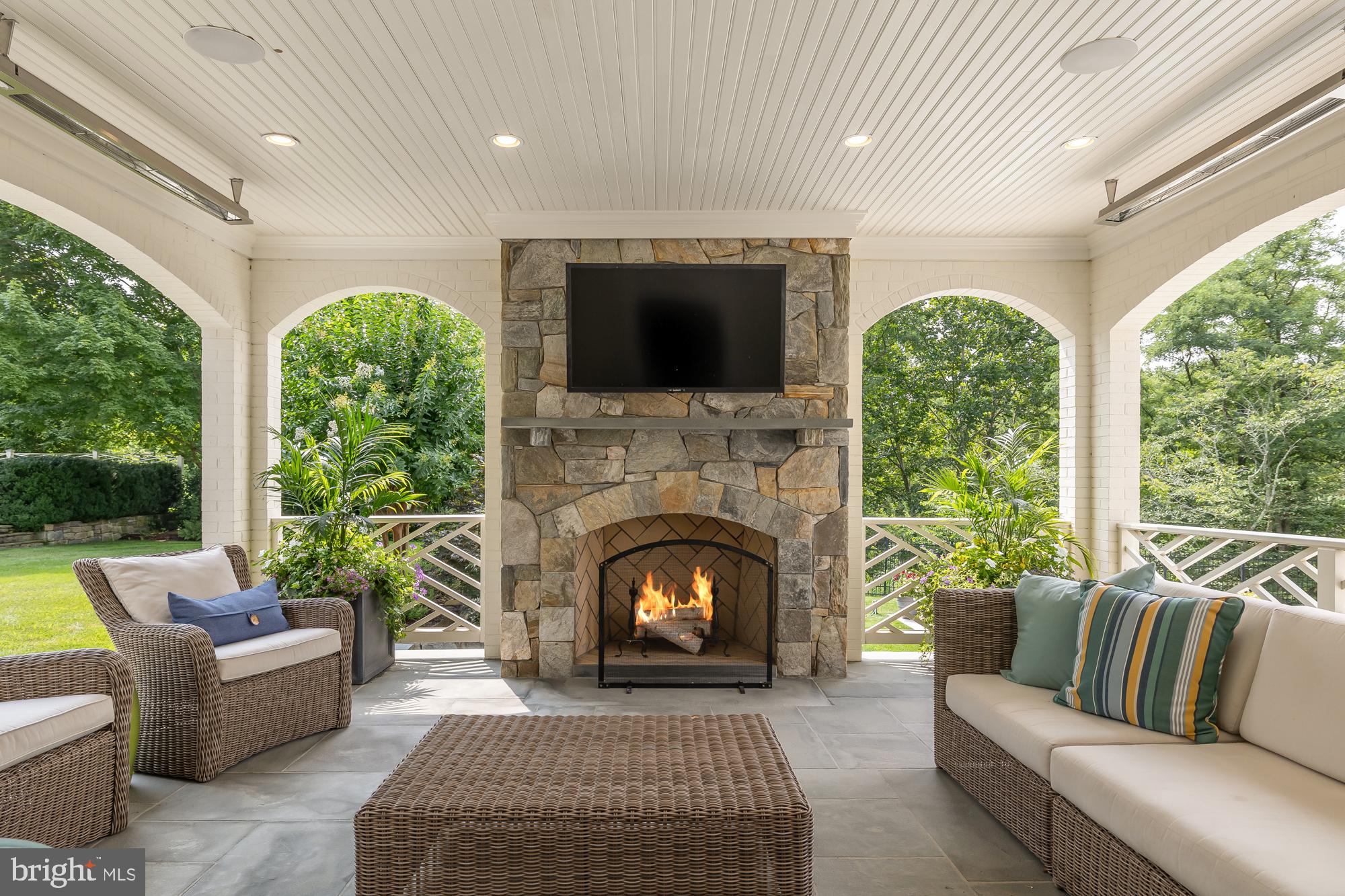11101 Piney Meetinghouse Road Potomac, MD 20854 - Photo 71 of 96 Cozy outdoor retreat with a fireplace.