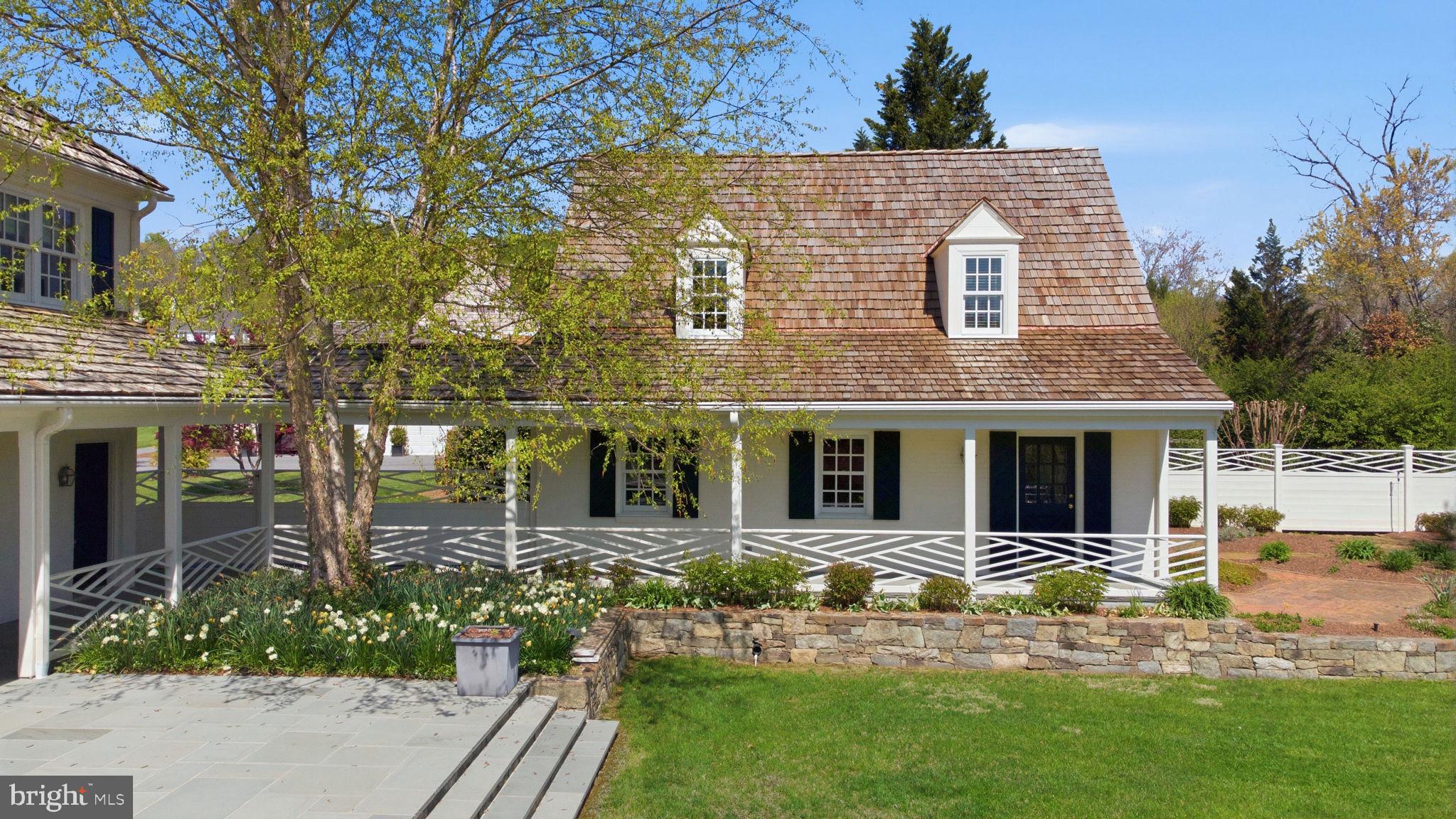 11101 Piney Meetinghouse Road Potomac, MD 20854 - Photo 73 of 96 Charming cottage with lush greenery.
