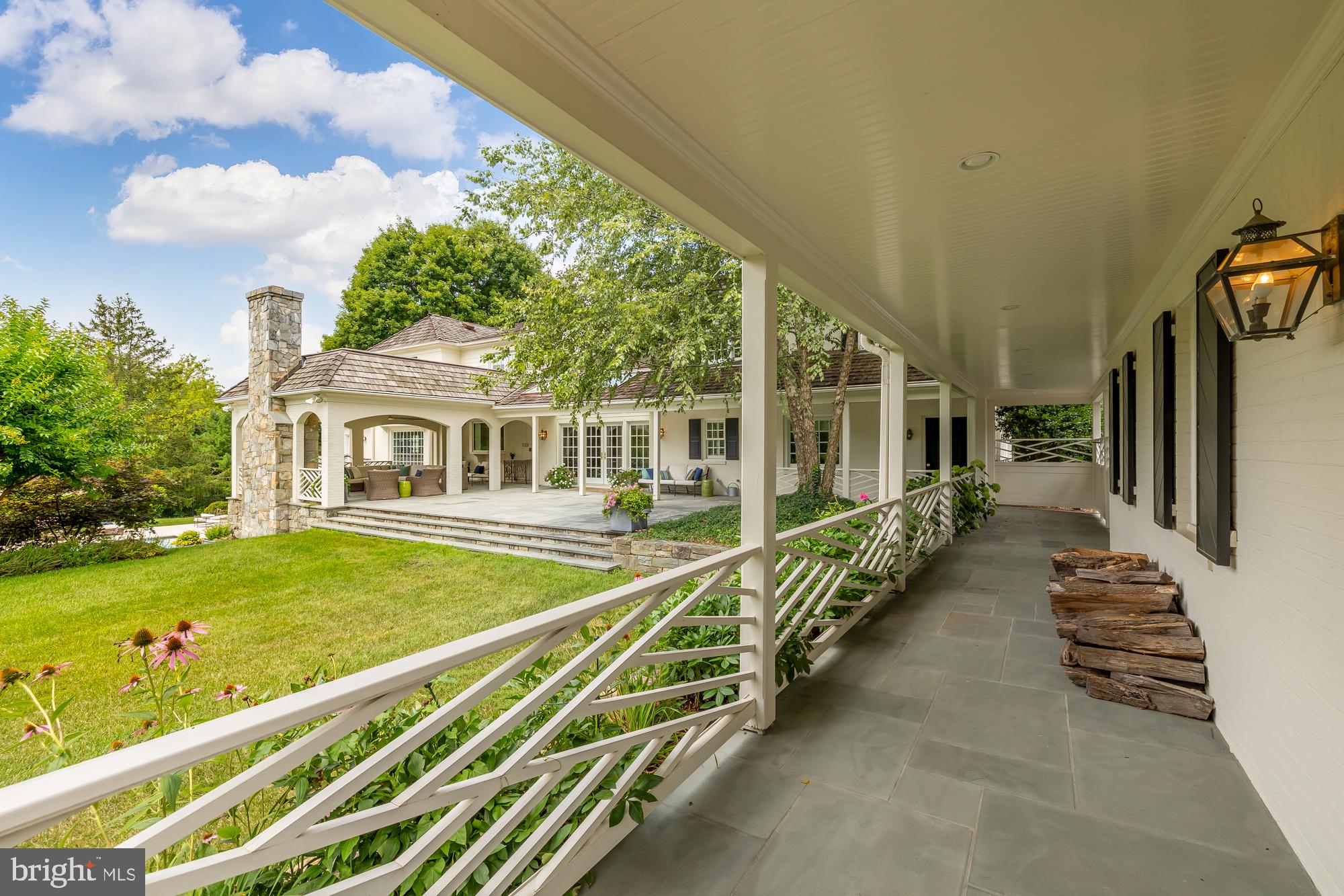 11101 Piney Meetinghouse Road Potomac, MD 20854 - Photo 77 of 96 Charming porch with lush garden views.