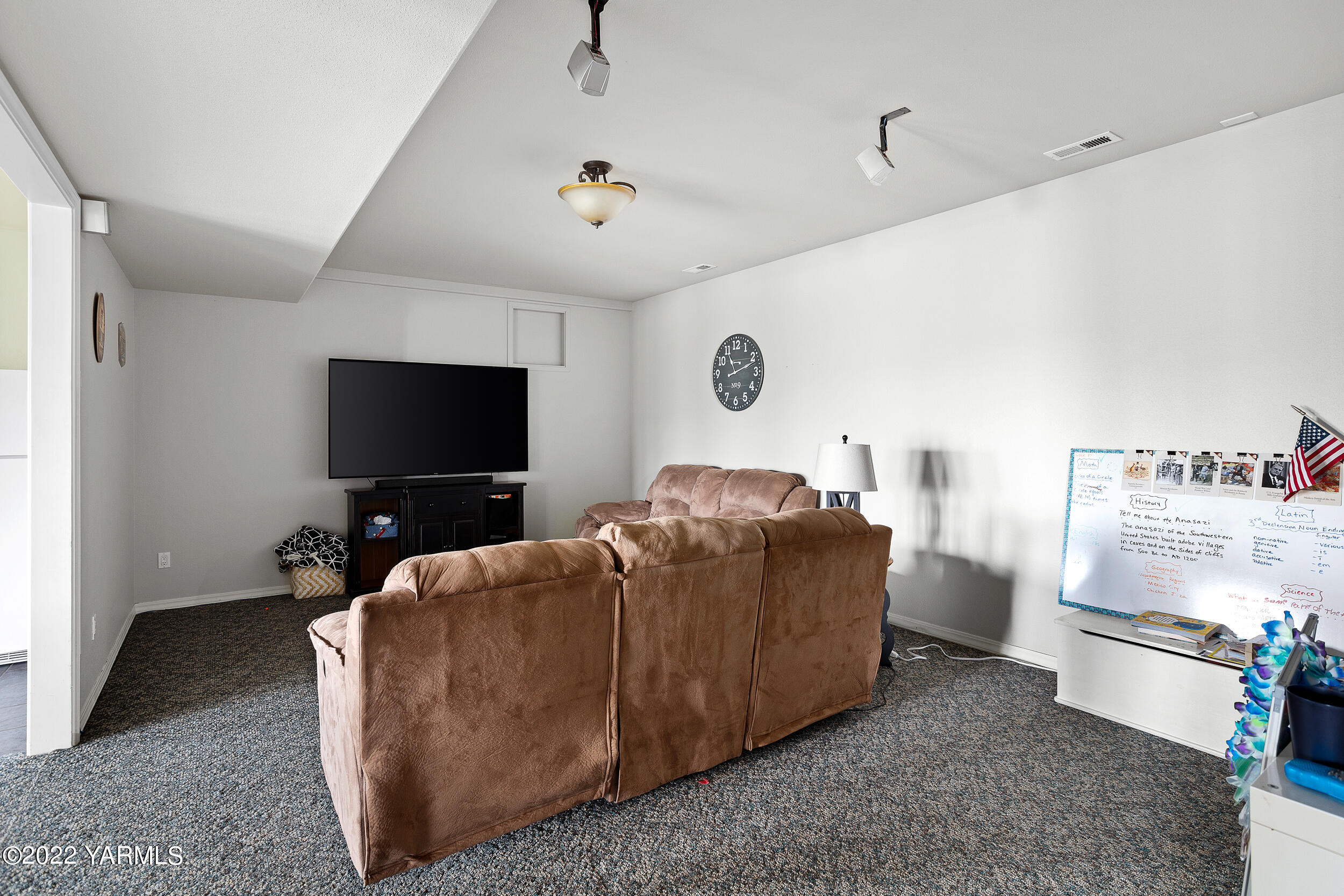805 South Hennessy Road Yakima, WA 98908 - Photo 18 of 26 a living room with furniture and a flat screen tv