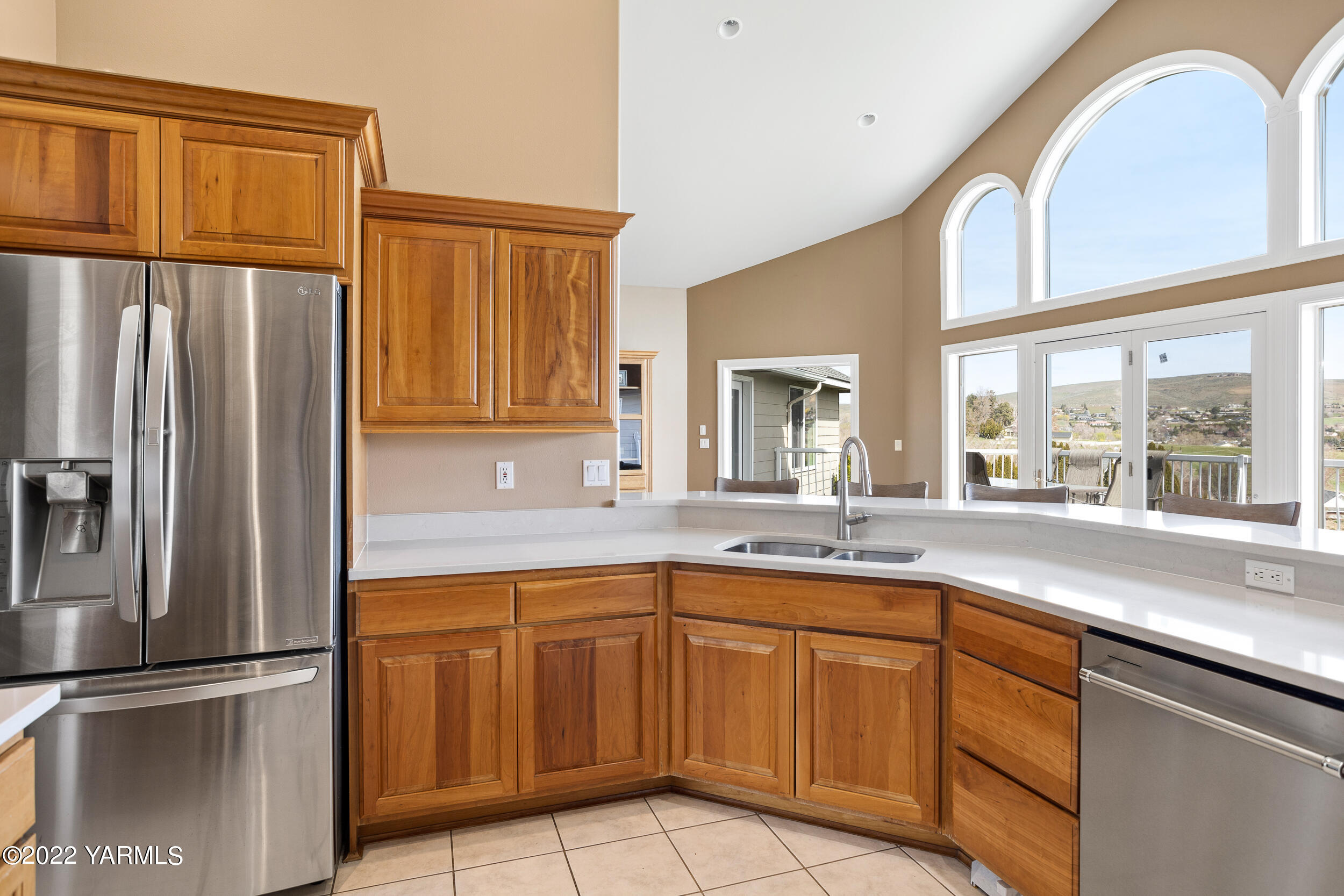 805 South Hennessy Road Yakima, WA 98908 - Photo 8 of 26 a kitchen with a sink stainless steel appliances and window