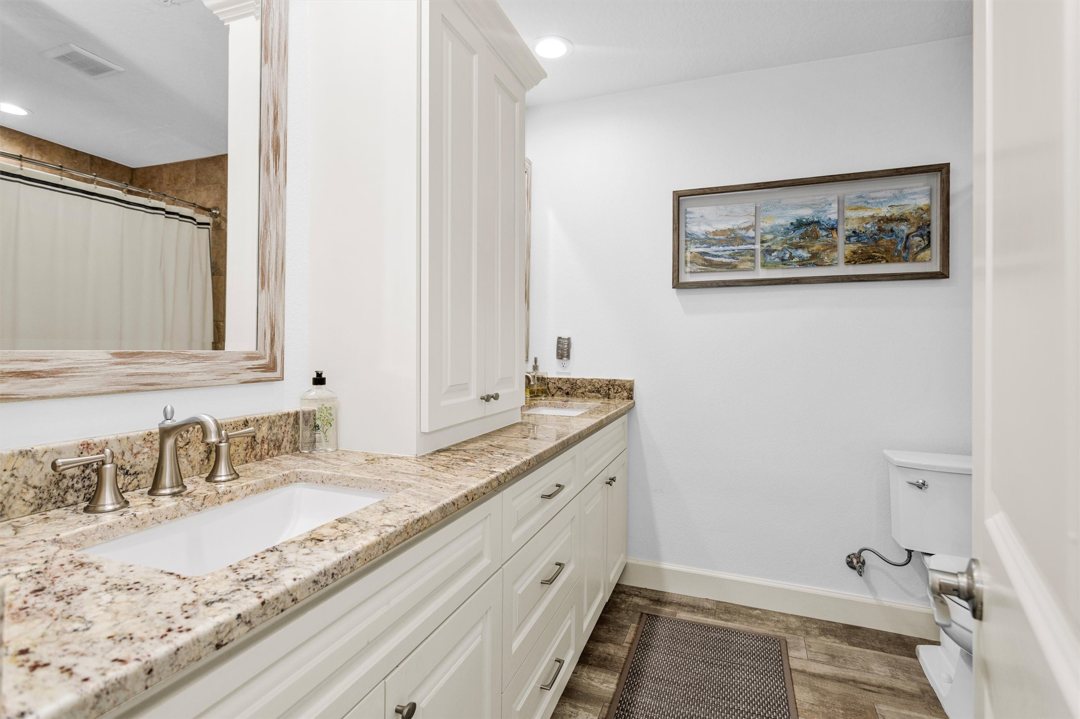 4402 Spears Road Manvel, TX 77578 - Photo 25 of 38 a bathroom with a granite countertop sink and a mirror