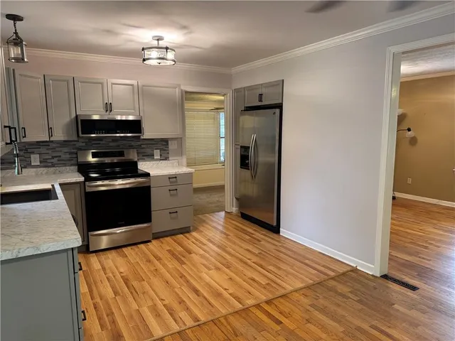 a kitchen with a sink and a window
