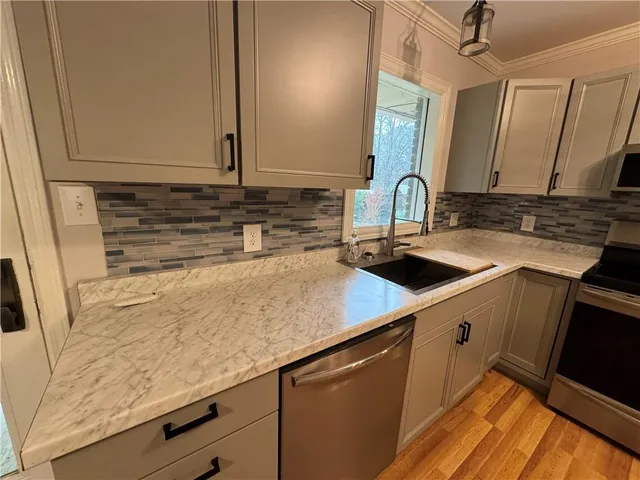 a kitchen with a stove and a sink