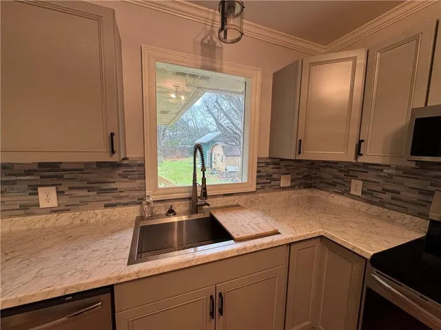 a view of a kitchen cabinets and wooden floor