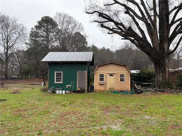 a backyard of a house with swimming pool