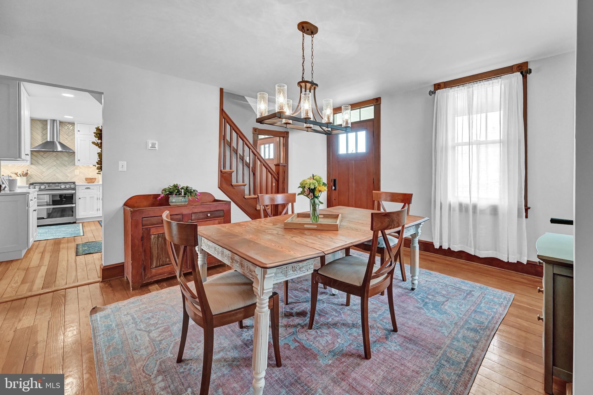 4207 Beckleysville Road Hampstead, MD 21074 - Photo 16 of 68 a view of a dining room with furniture window and wooden floor