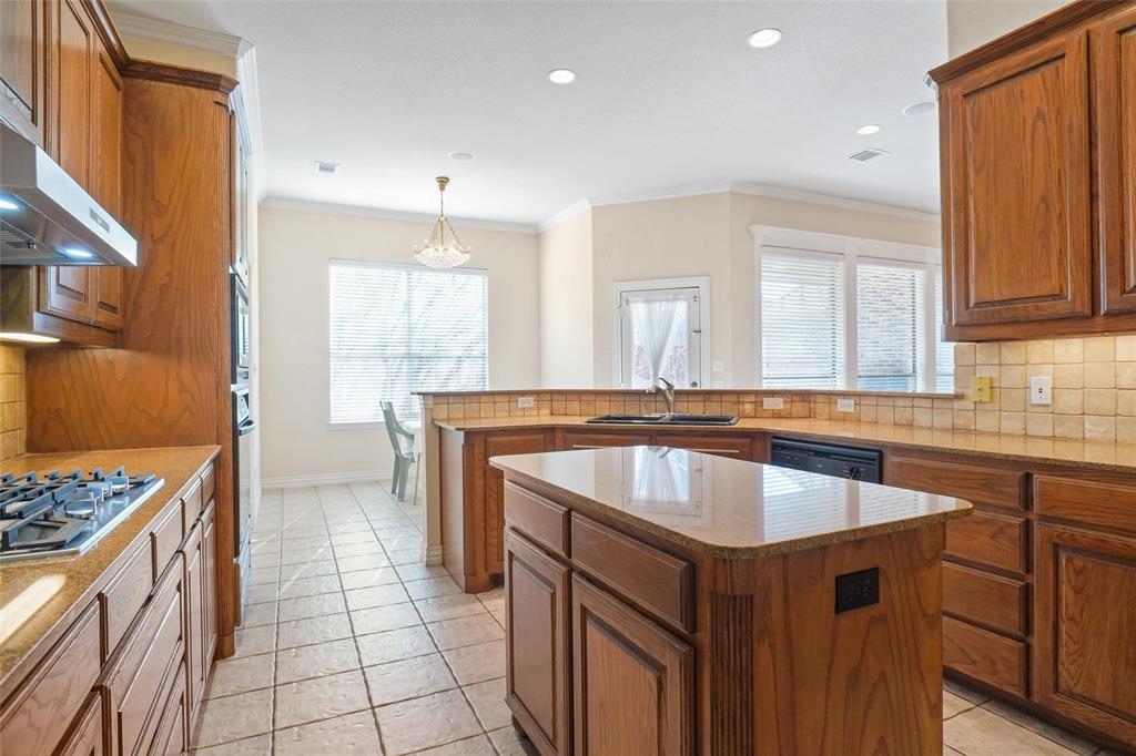 756 Trails End Circle Hurst, TX 76054 - Photo 11 of 26 a kitchen with a sink stove and cabinets