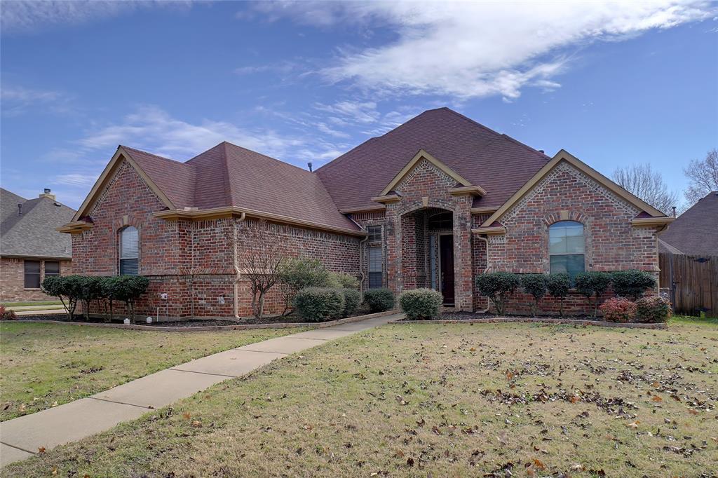 756 Trails End Circle Hurst, TX 76054 - Photo 2 of 26 a front view of a house with a yard