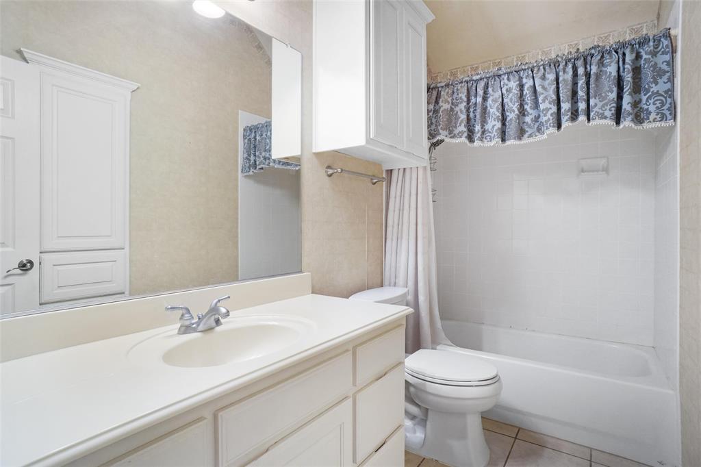 756 Trails End Circle Hurst, TX 76054 - Photo 23 of 26 a bathroom with a sink toilet and shower