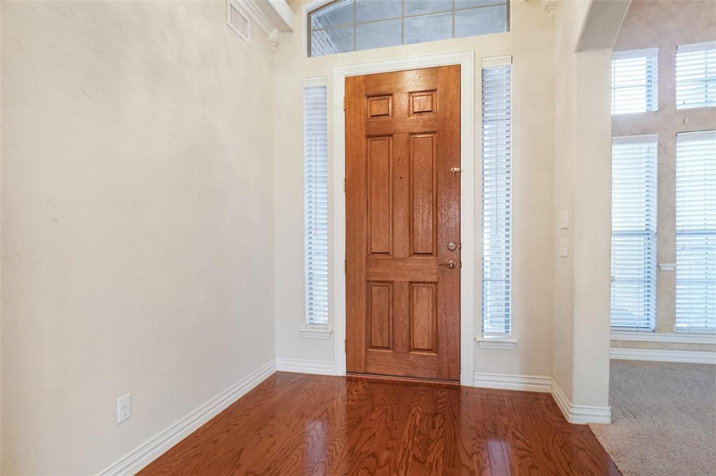 756 Trails End Circle Hurst, TX 76054 - Photo 4 of 26 a view of front door with wooden floor