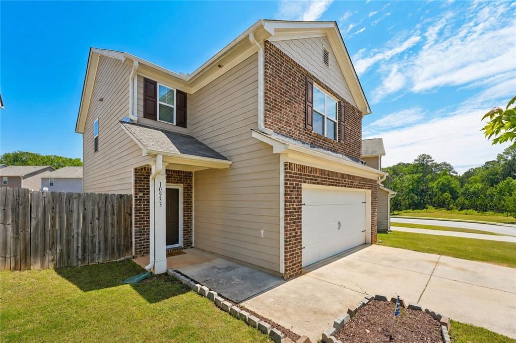10933 Wheeler Trace Hampton, GA 30228 - Photo 3 of 22 a view of a house with a yard