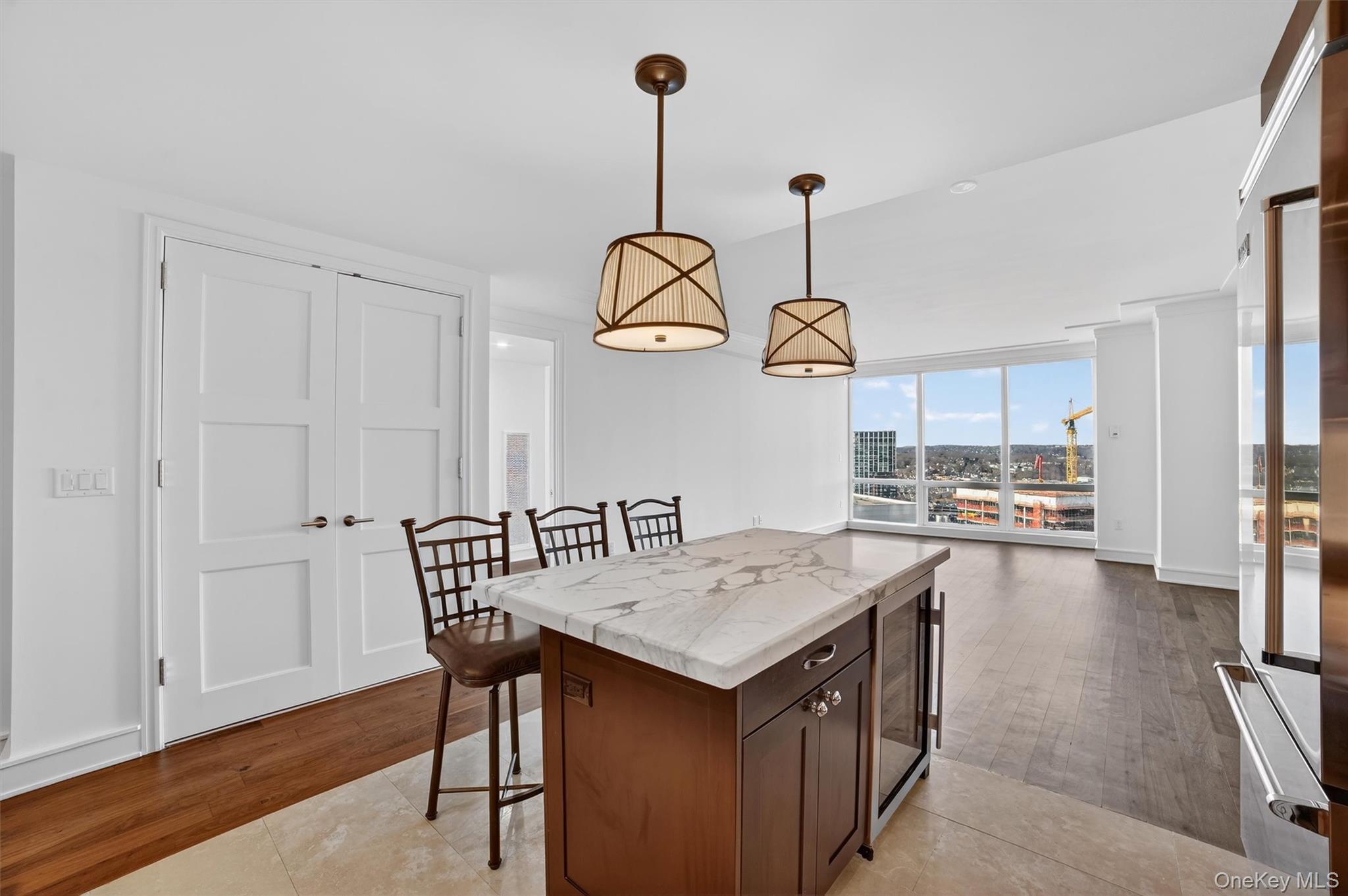 1 Renaissance Square, Unit 26F White Plains, NY 10601 - Photo 11 of 33 a view of a dining table and chairs