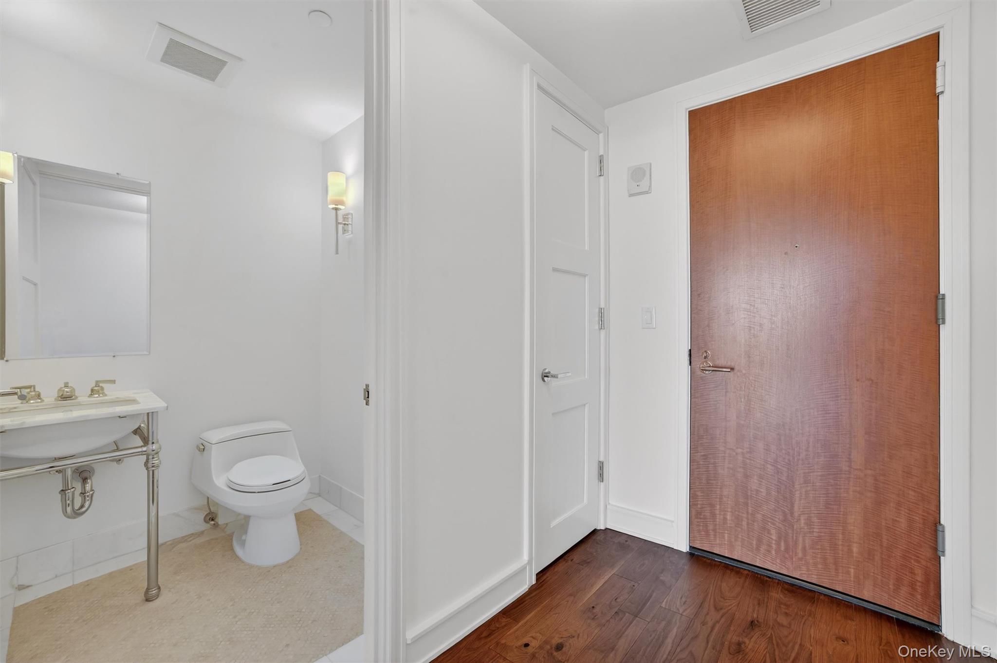 1 Renaissance Square, Unit 26F White Plains, NY 10601 - Photo 15 of 33 a view of a bathroom with a toilet sink