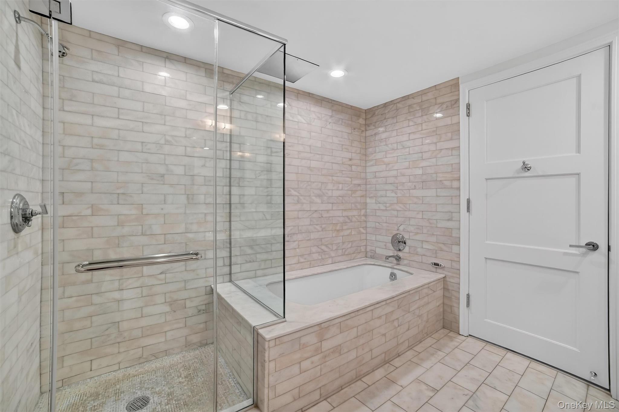 1 Renaissance Square, Unit 26F White Plains, NY 10601 - Photo 27 of 33 a bathroom with a bathtub and a shower