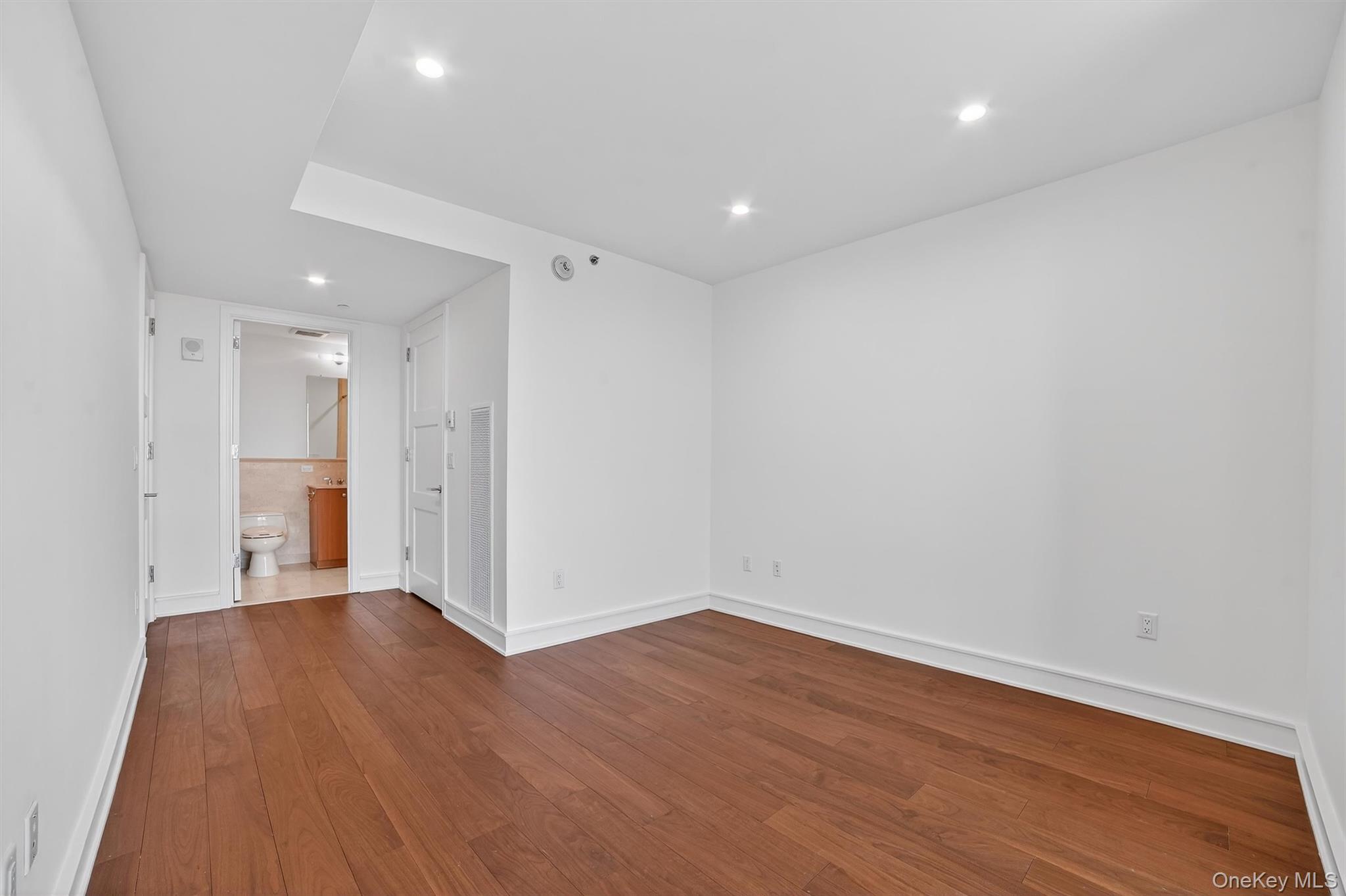 1 Renaissance Square, Unit 26F White Plains, NY 10601 - Photo 31 of 33 a view of an empty room with wooden floor
