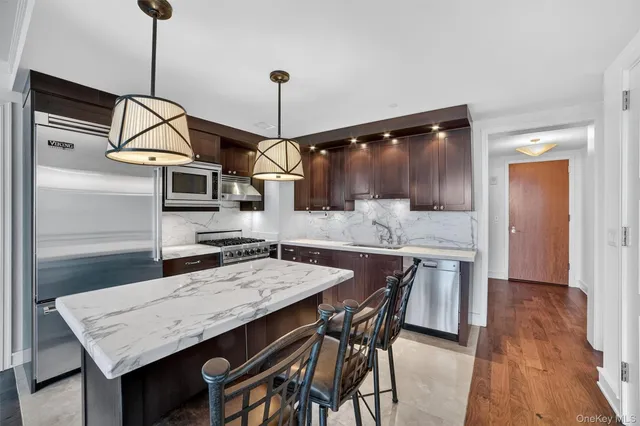 a kitchen with a table and chairs in it