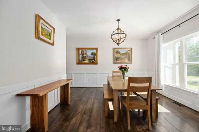 a kitchen with a stove sink and cabinets