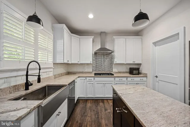 a bathroom with bathtub and window
