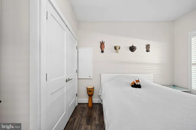 a bathroom with a granite countertop shower sink and mirror