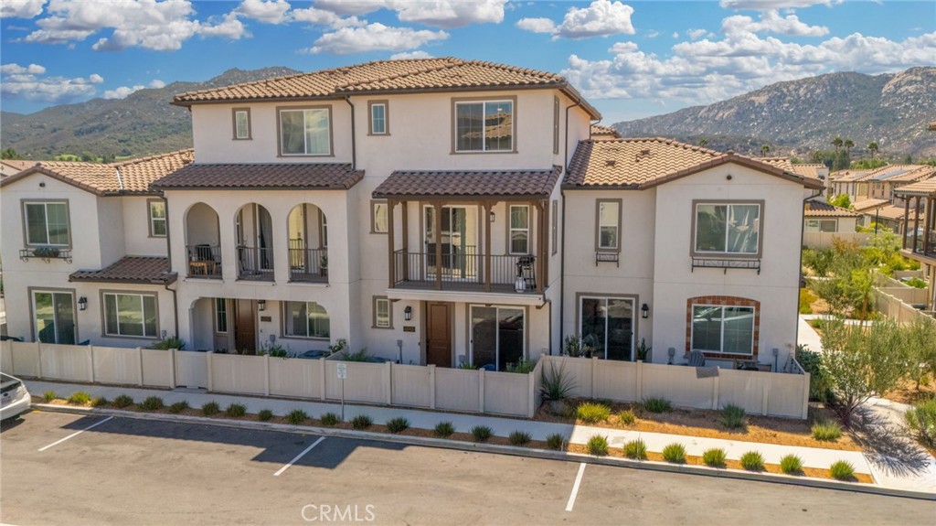 45763 Via Nubes Temecula, CA 92592 - Photo 1 of 1 a front view of a house with a yard