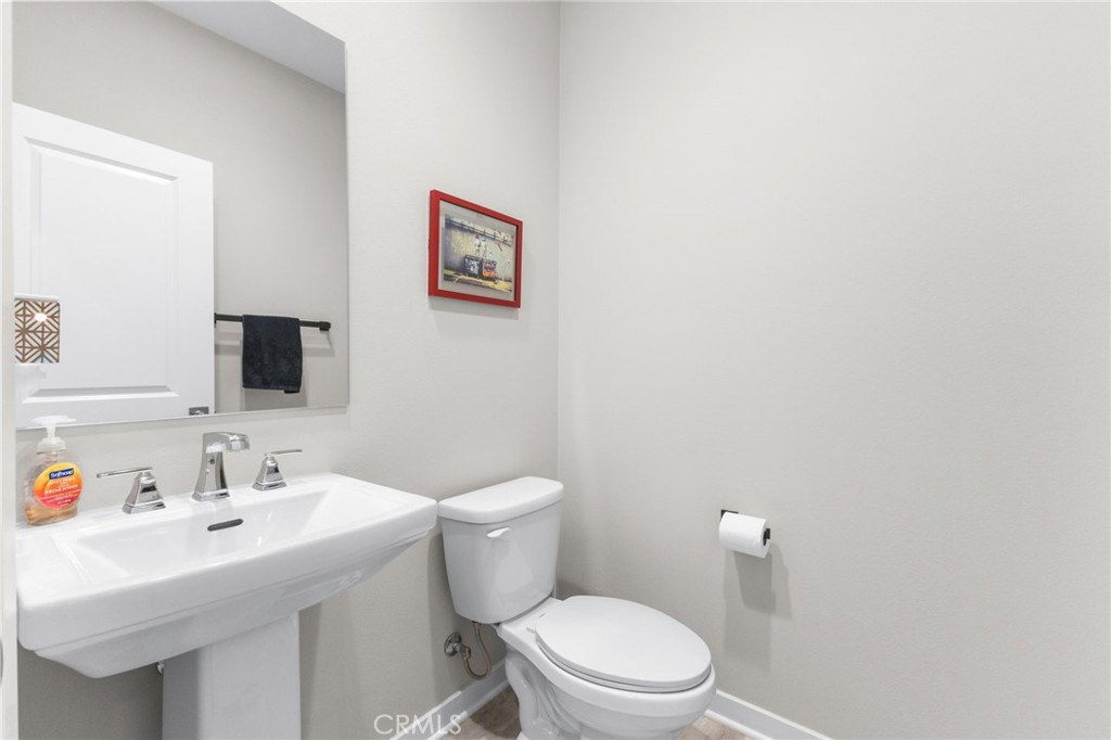 45763 Via Nubes Temecula, CA 92592 - Photo 32 of 63 a bathroom with a sink mirror and toilet