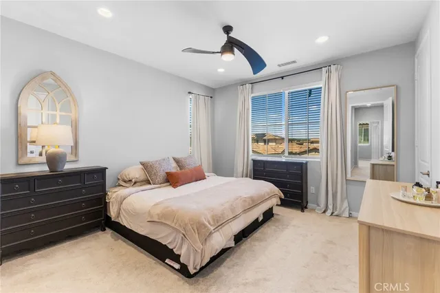 a bathroom with a double vanity sink mirror and shower
