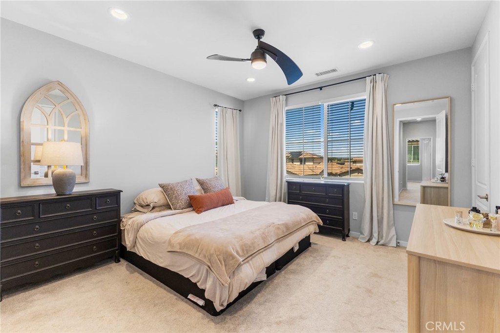 45763 Via Nubes Temecula, CA 92592 - Photo 33 of 63 a bedroom with a bed and a dresser