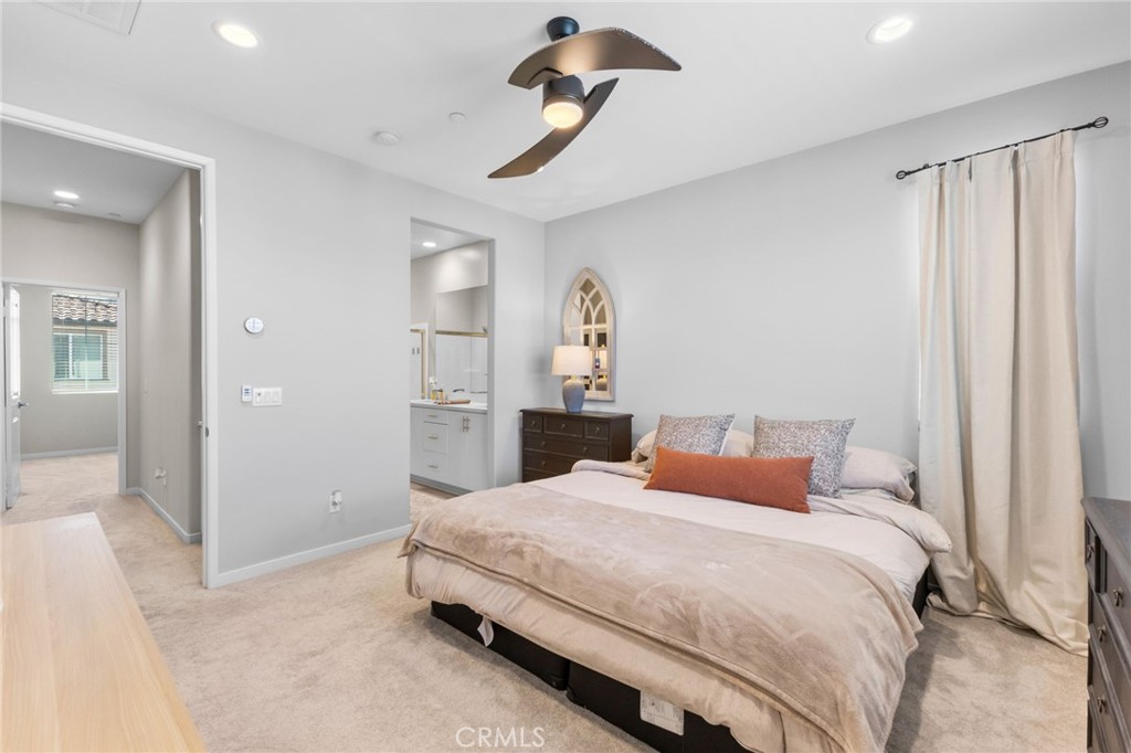 45763 Via Nubes Temecula, CA 92592 - Photo 34 of 63 a bedroom with a bed and a chandelier