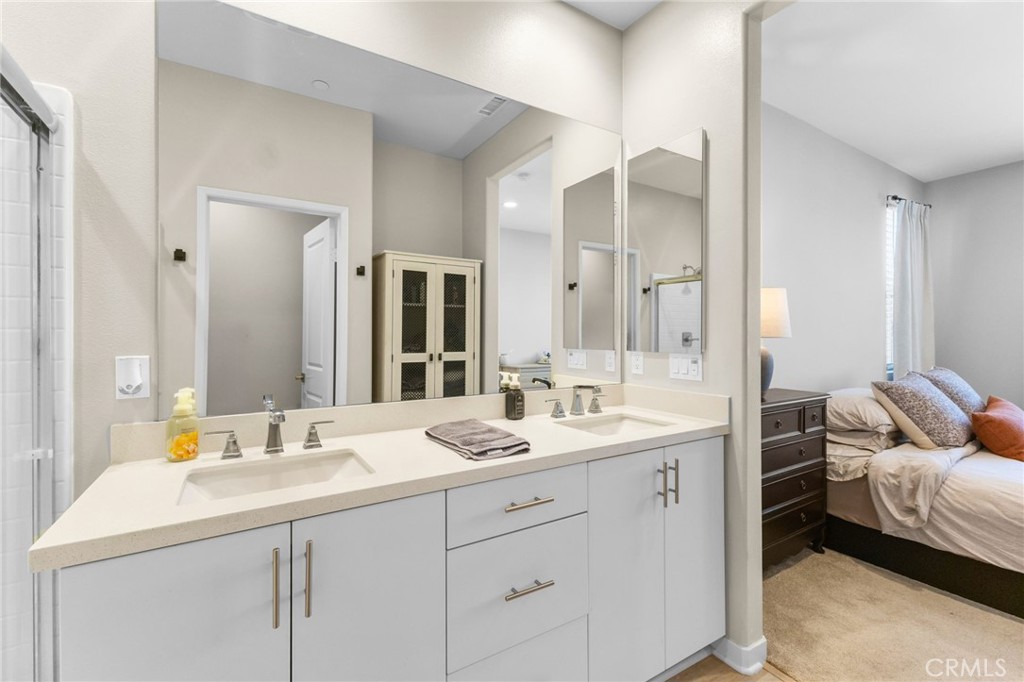 45763 Via Nubes Temecula, CA 92592 - Photo 37 of 63 a bathroom with a double vanity sink mirror and