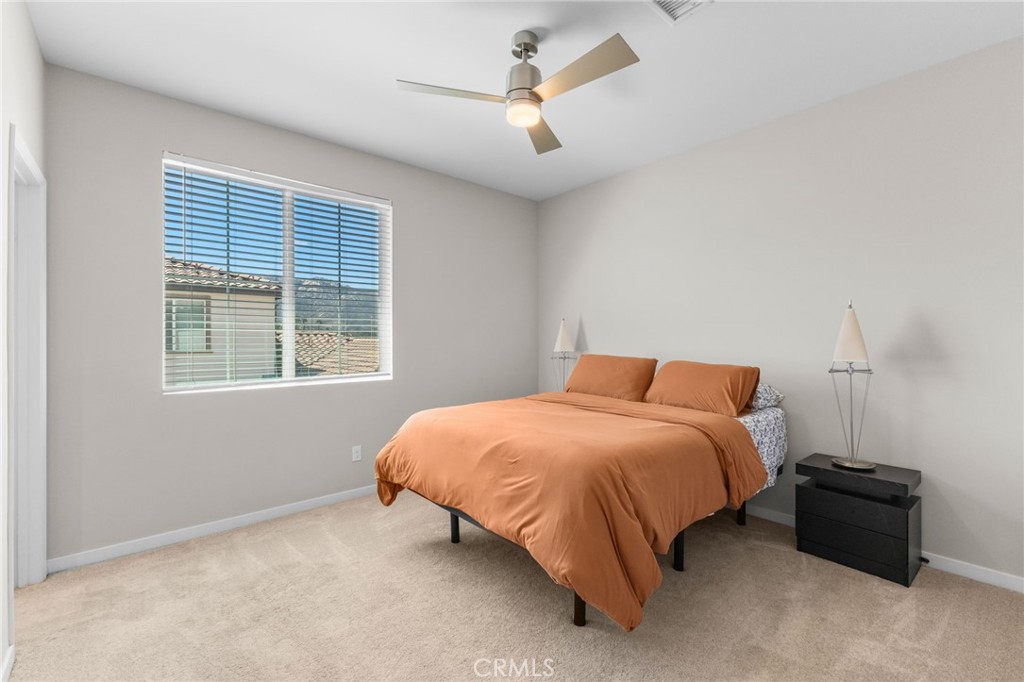 45763 Via Nubes Temecula, CA 92592 - Photo 38 of 63 a bedroom with a bed and a window