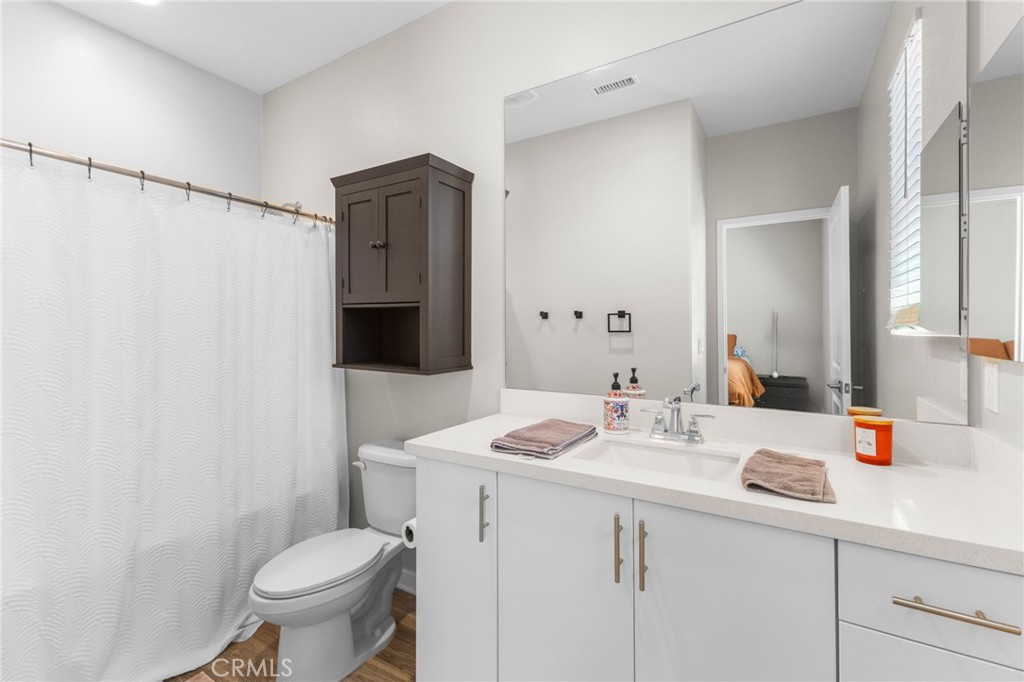 45763 Via Nubes Temecula, CA 92592 - Photo 41 of 63 a bathroom with a sink toilet and shower