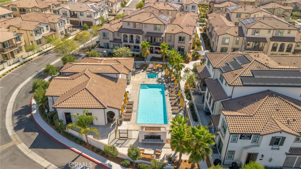 45763 Via Nubes Temecula, CA 92592 - Photo 51 of 63 an aerial view of a residential apartment building with a yard