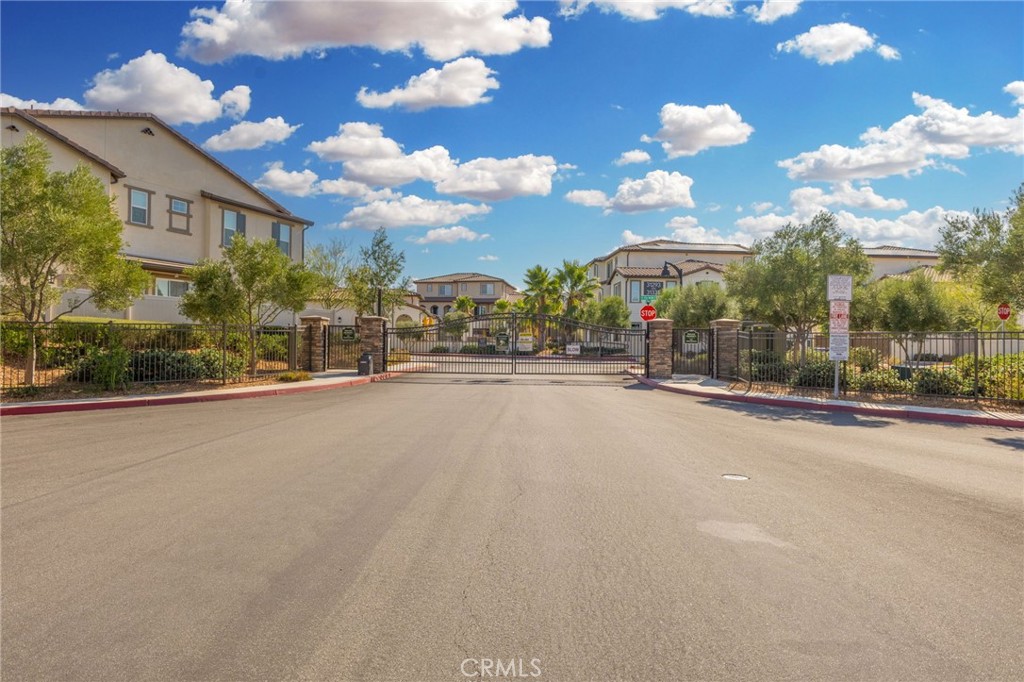 45763 Via Nubes Temecula, CA 92592 - Photo 60 of 63 a view of a street with a building in the background