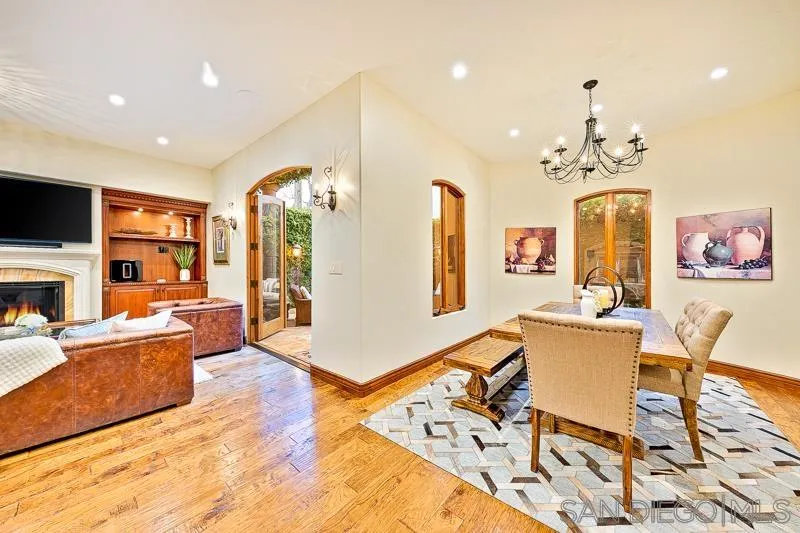 7964 Prospect Place La Jolla, CA 92037 - Photo 15 of 46 a living room with fireplace furniture and a flat screen tv