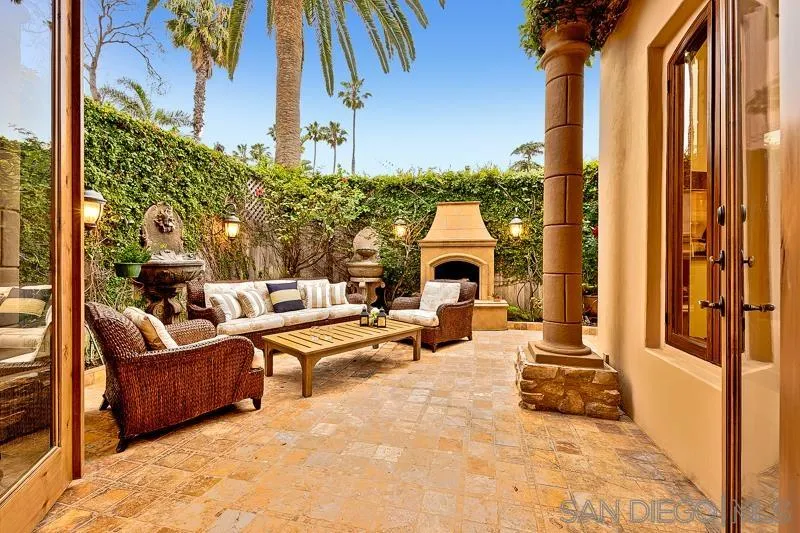 7964 Prospect Place La Jolla, CA 92037 - Photo 16 of 46 a view of a patio with couches and potted plants