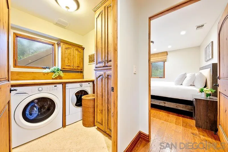 7964 Prospect Place La Jolla, CA 92037 - Photo 34 of 46 a en suite bathroom with a sink and a mirror