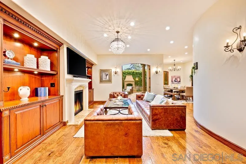 7964 Prospect Place La Jolla, CA 92037 - Photo 4 of 46 a living room with fireplace furniture and a flat screen tv