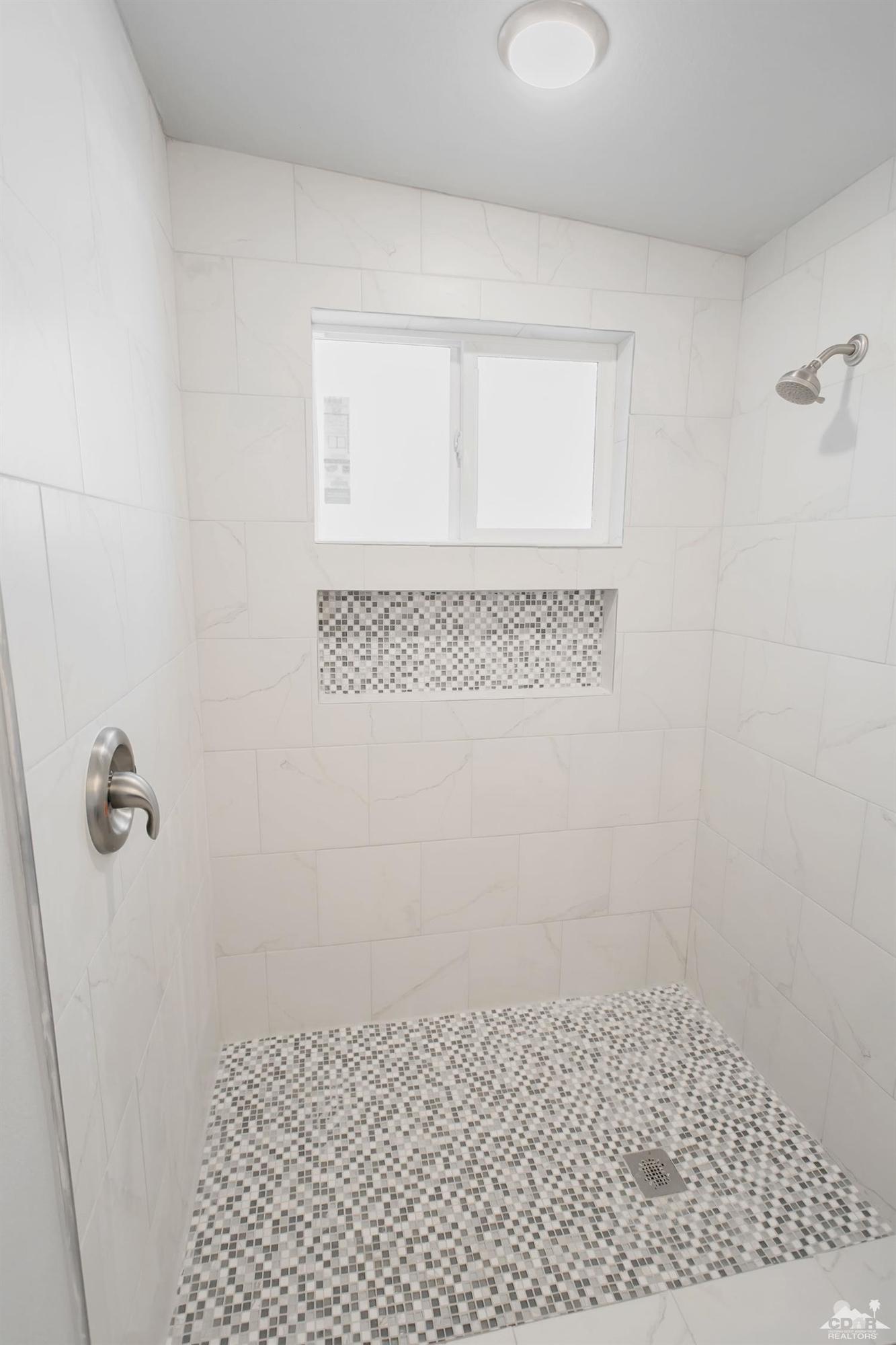 71933 Vista Del Rio Rancho Mirage, CA 92270 - Photo 15 of 32 a bathroom with a shower
