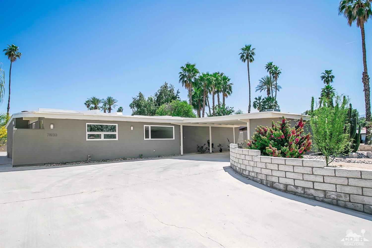 71933 Vista Del Rio Rancho Mirage, CA 92270 - Photo 3 of 32 a front view of a house with a yard