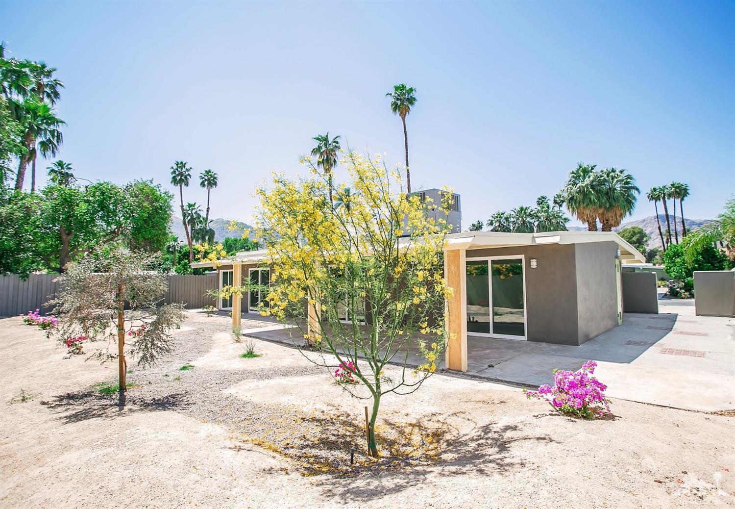 71933 Vista Del Rio Rancho Mirage, CA 92270 - Photo 6 of 32 a front view of a house with a yard