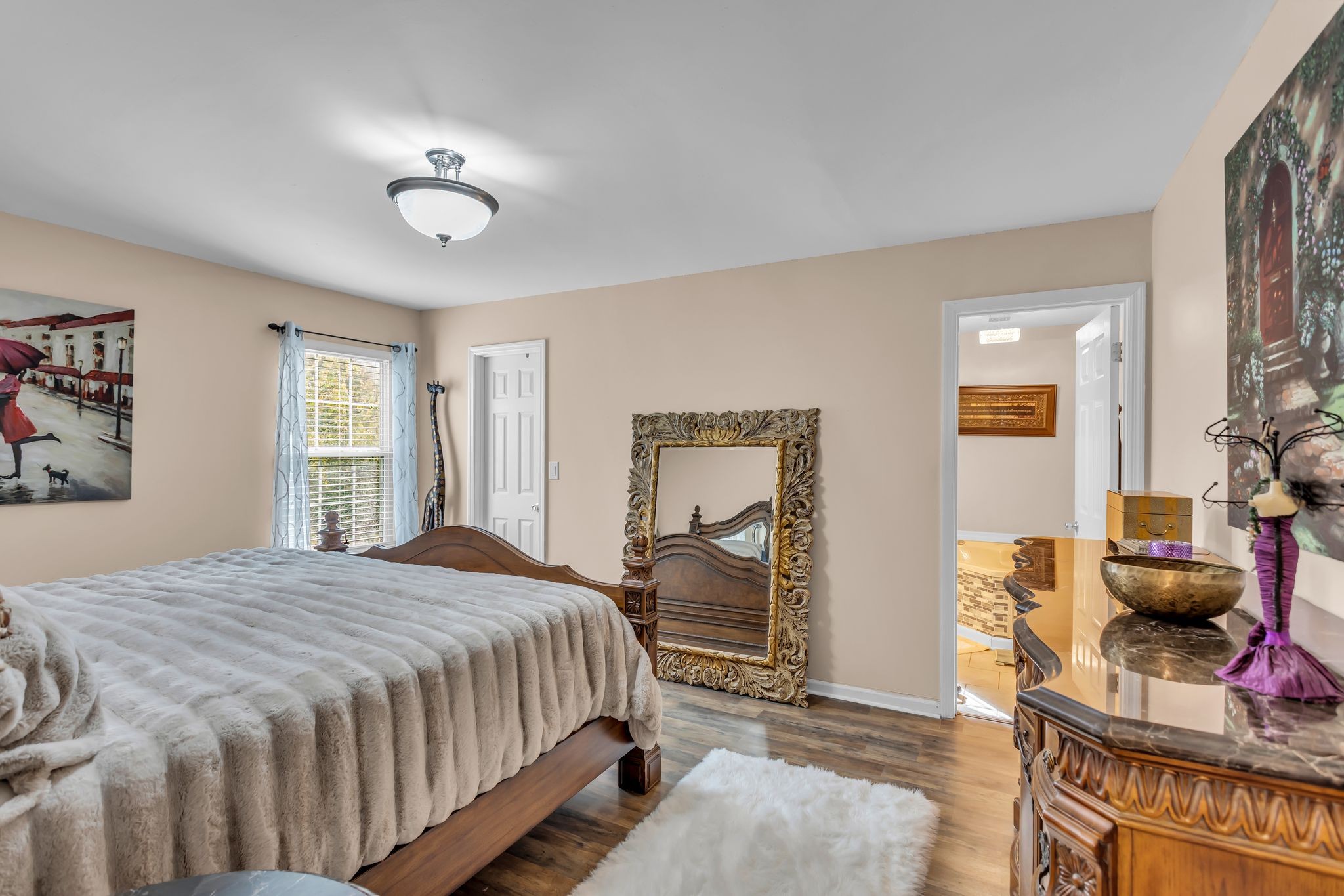 116 Jackson Street Mount Pleasant, TN 38474 - Photo 14 of 27 a bedroom with a bed and wooden floor