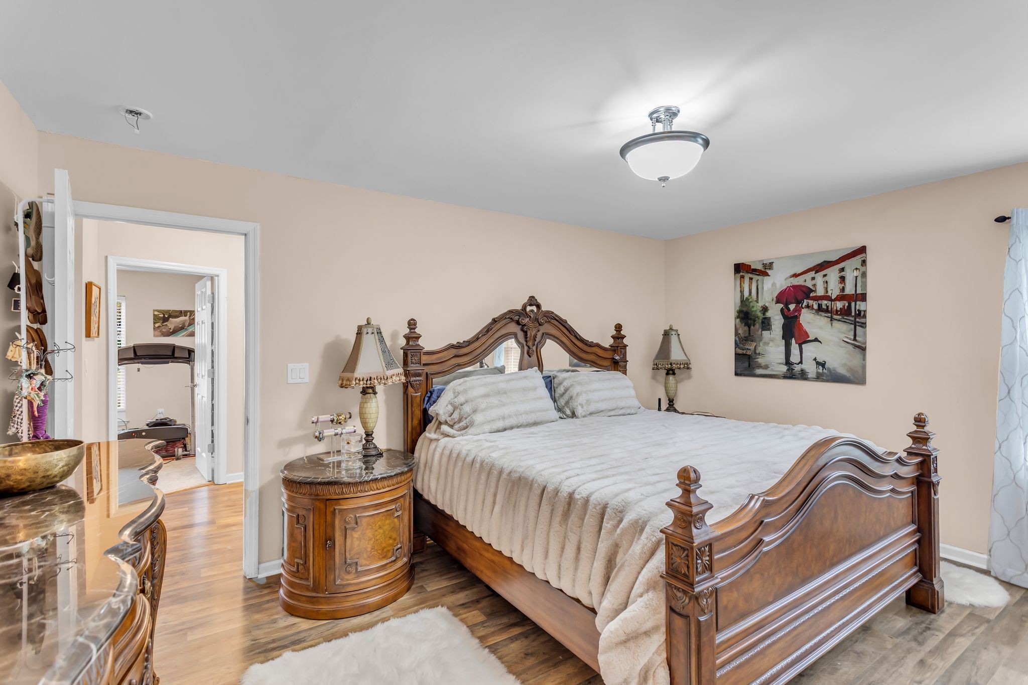 116 Jackson Street Mount Pleasant, TN 38474 - Photo 15 of 27 a bedroom with a bed and a chandelier