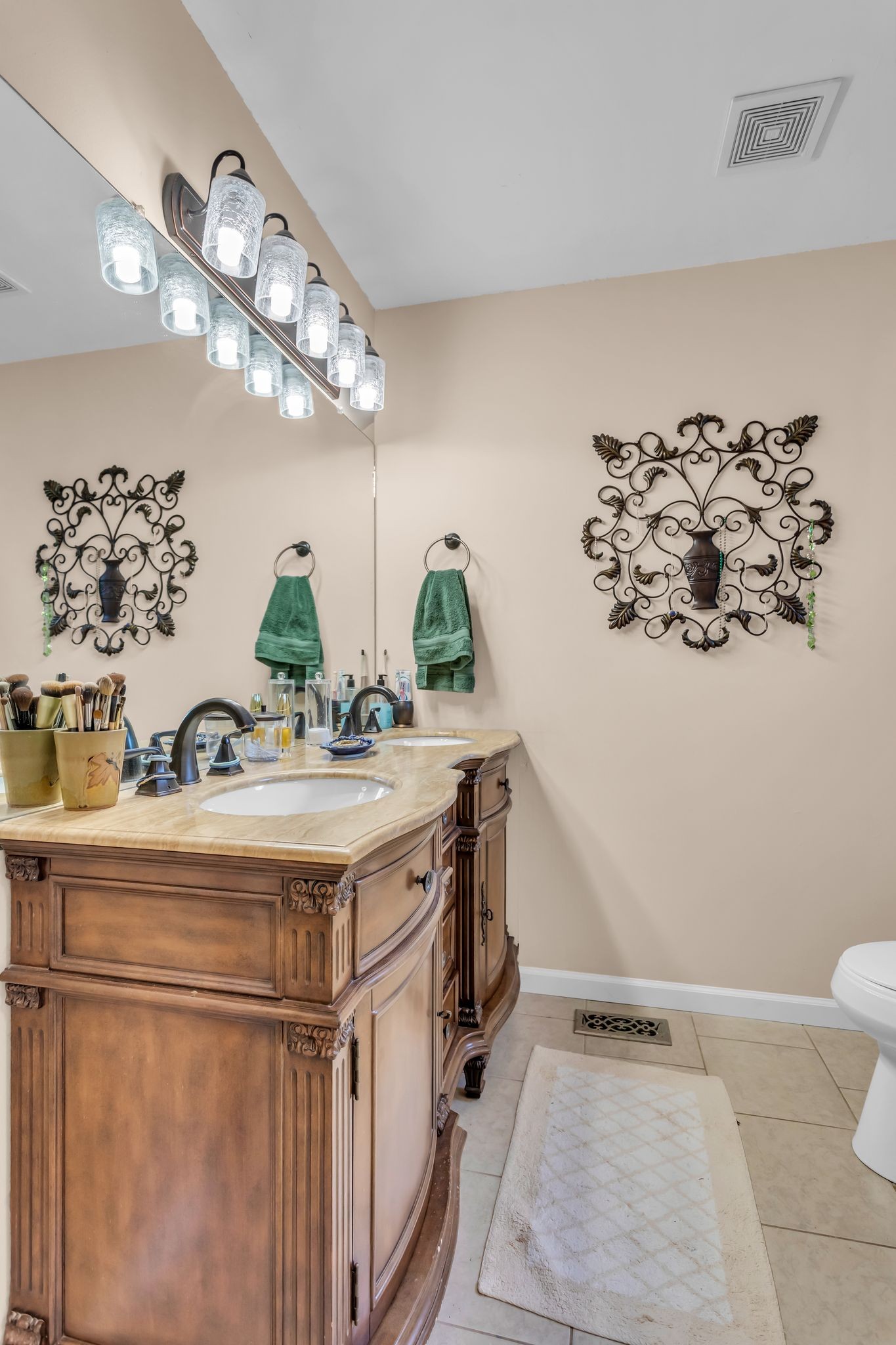 116 Jackson Street Mount Pleasant, TN 38474 - Photo 16 of 27 a bathroom with a sink a mirror and a toilet