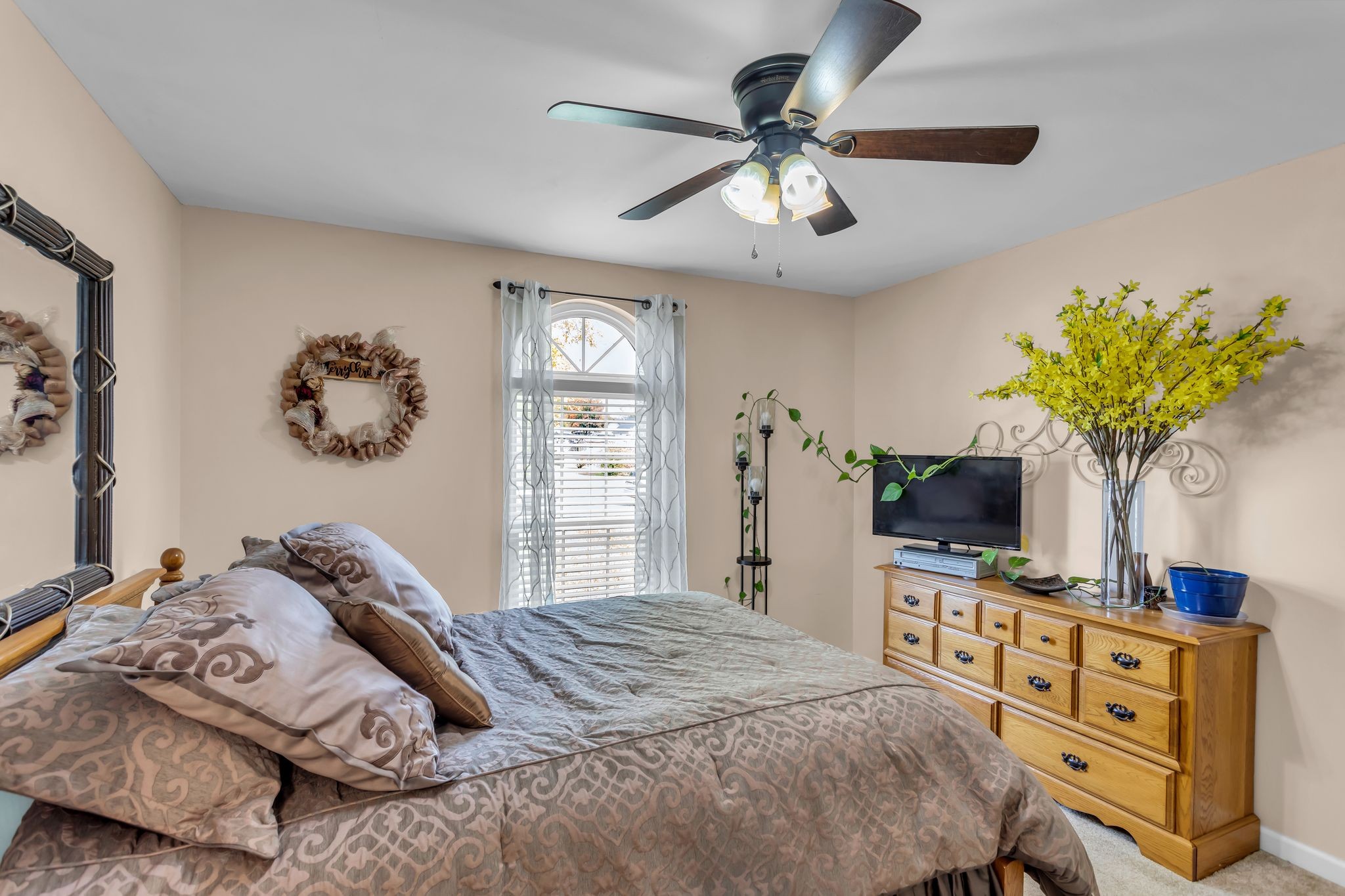 116 Jackson Street Mount Pleasant, TN 38474 - Photo 18 of 27 a bedroom with a bed and a flat tv screen on dresser