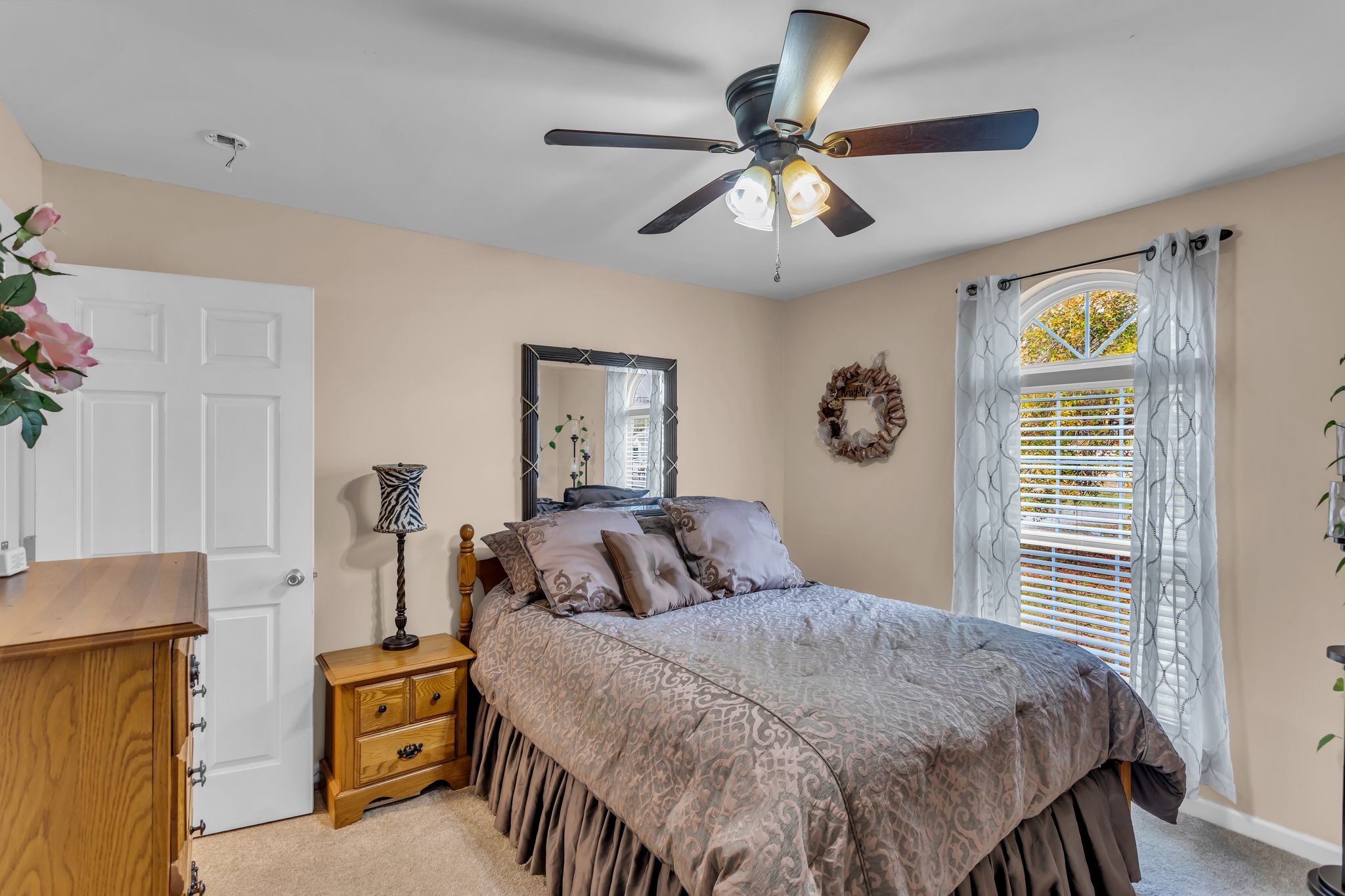 116 Jackson Street Mount Pleasant, TN 38474 - Photo 19 of 27 a bedroom with a bed and a chandelier